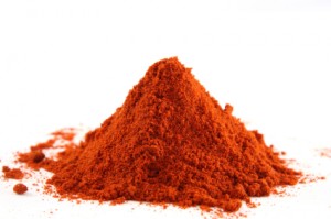 pile of ground paprika on white